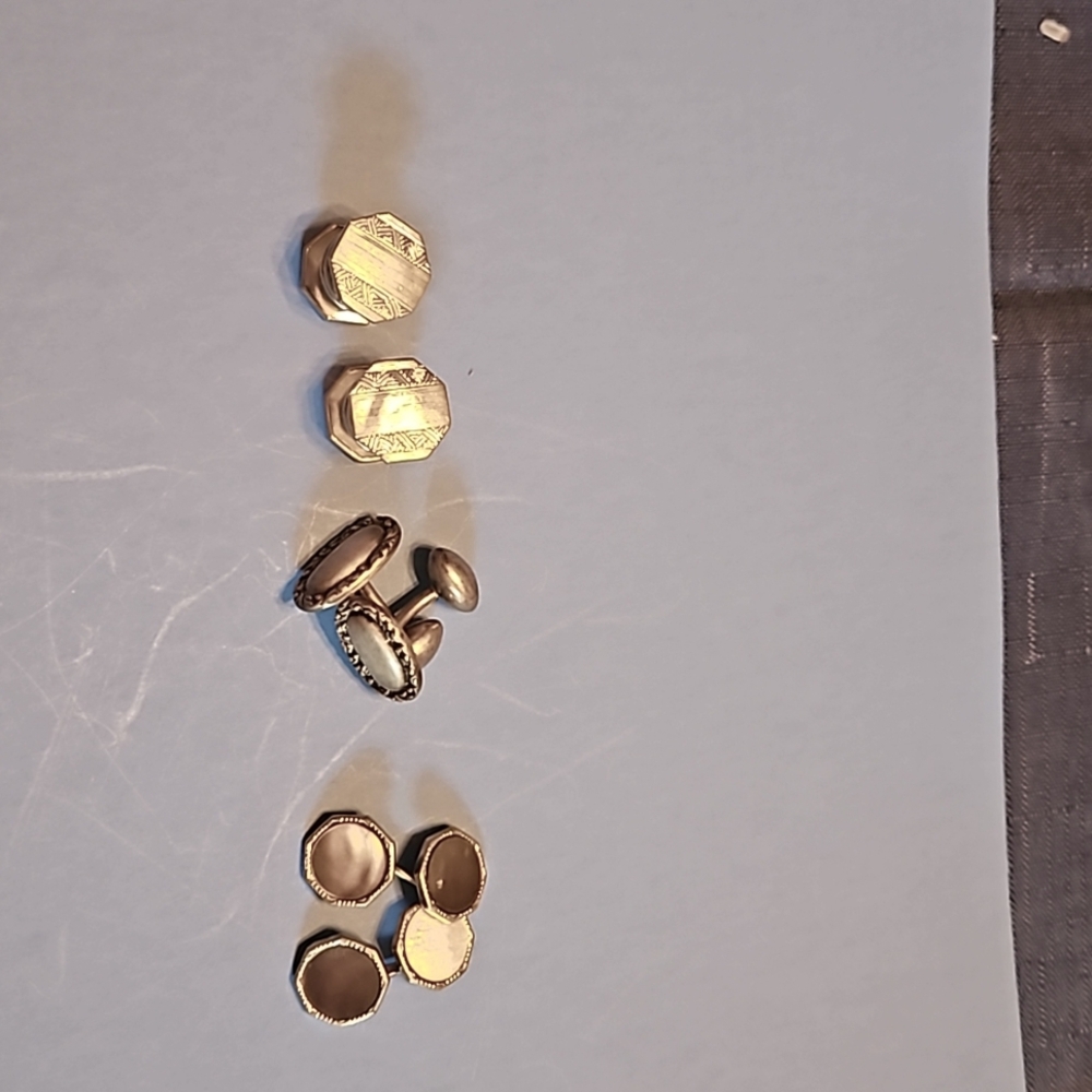 Three pairs of silver cuff links
